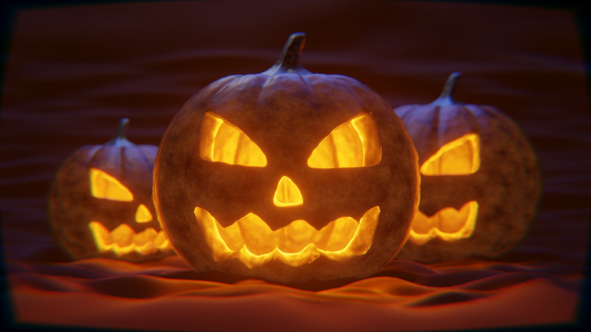 3 carved Halloween pumpkins against a dark background, illustrating the scary financial mistakes one could be making
