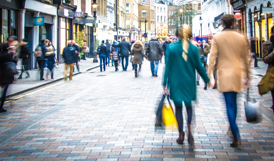 A busy high street in the UK, illustrating an article on recession in 2023
